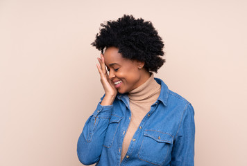 African american woman over isolated background laughing