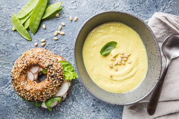 Cauliflower soup puree on a stone background, top view. Vegetarian healthy food concept