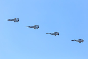 Russian Military jet in the air. Silhouettes of russian fighter aircrafts in the sky. military aircrafts flying together in the sky during airshow