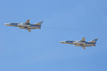 Russian Military jet in the air. Silhouettes of russian fighter aircrafts in the sky. military aircrafts flying together in the sky during airshow