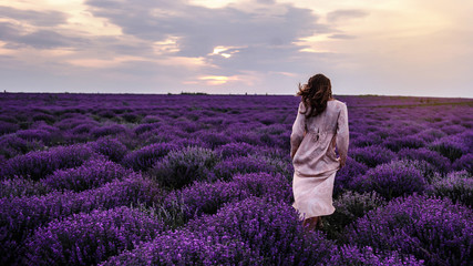 back view of a woman with hat in lavander field