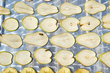 the process of drying apples and pears. harvesting of dried fruits for the winter