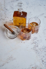 Bottle and glasses of brandy or wiskey and nice big cuban cigar