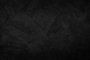 Dark black grunge background. The texture of the old plaster.