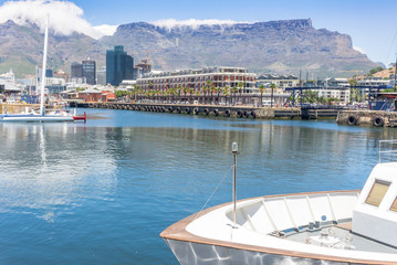 V&A Waterfront with boat in foreground and Table Mountain in background