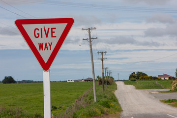 Countryroad. Give way sign. . Mokotua South island New Zealand.