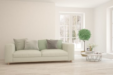 Stylish room in white color with sofa and winter landscape in window. Scandinavian interior design. 3D illustration