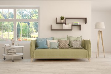 Stylish room in white color with sofa and summer landscape in window. Scandinavian interior design. 3D illustration