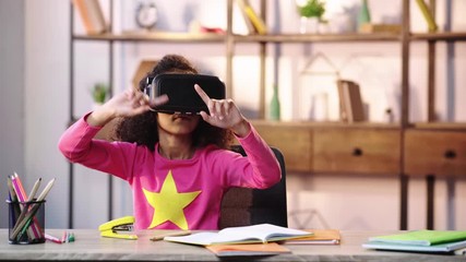 african american child gesturing in vr headset - Powered by Adobe