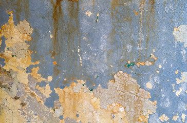 Detail of old blue peeling wall