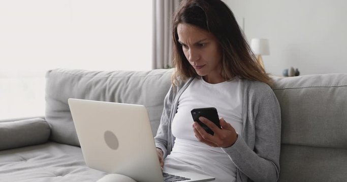 Young woman entering promo code from sms.