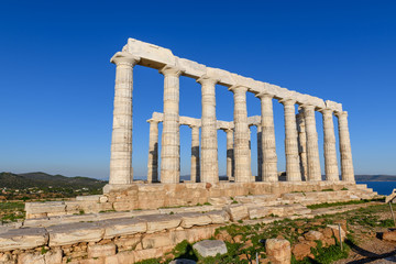 Fototapeta premium Ruins of ancient Temple of Poseidon at Cape Sounion in Attica, Greece