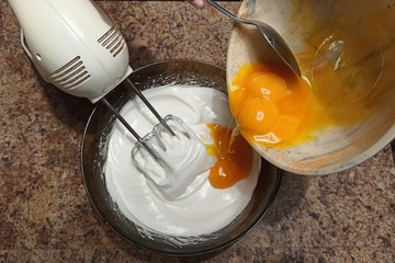 confectioner pour yolks to bowl with bizet