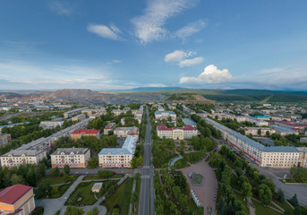 Fototapeta na wymiar Satka city. Square. Far away Karagai quarry. Chelyabinsk region, Russia. Aerial, summer, evening
