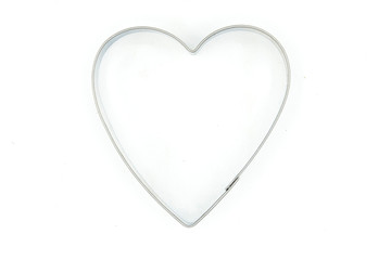 Heart shaped mold for cookies and biscuits on white background