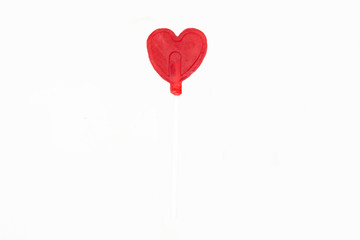 Fototapeta na wymiar heart shaped lollipop in white background