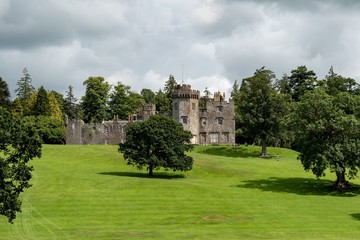 Fototapeta na wymiar The medieval Balloch Castle in Scotland build on a hill in an early 19th century during the nice summer day