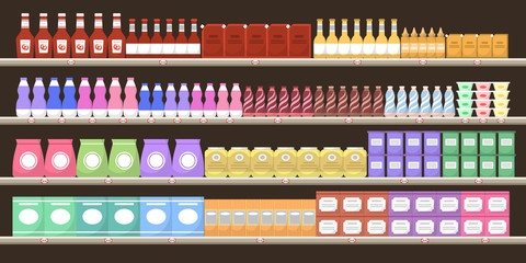 Supermarket shelves with various products. Groceries on shelves.