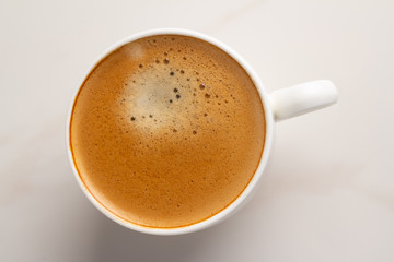cup of coffee on white background close up