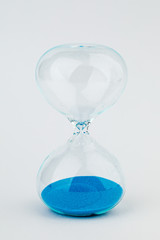 Hourglass as a concept of passing time. On white background