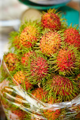 Fototapeta premium Rambutan at tropical fruit market 