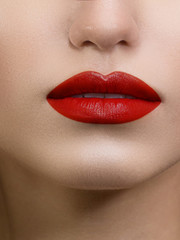 Sexual full lips. Natural gloss of lips and woman's skin. The mouth is closed. Increase in lips, cosmetology. Natural lips. Great summer mood with open eyes. Clean skin. Red lip gloss