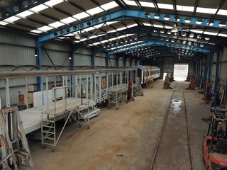 Painting and repairs at the train factory.