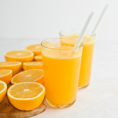 freshly squeezed orange juice and slices of orange fruit