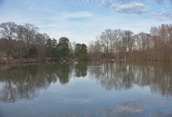 Fototapeta na wymiar Reflection of trees and sky in lake