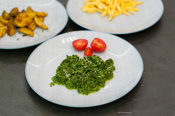 Braised spinach with cheese and tomatoes. Vegetarian food, side dish or appetizer.