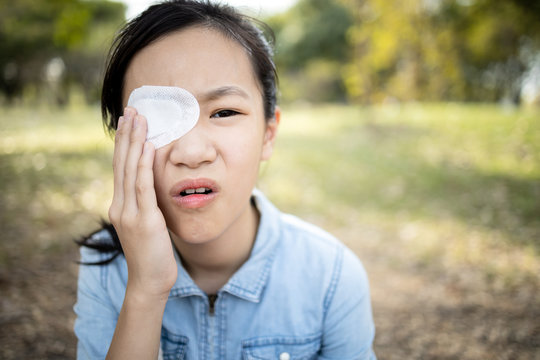 Asian Child Girl Has A Blindfolded Bandaged Eye,female People Cover With Blindfolded To Protect Against Dust Or Redness,feel Pain,eyes Injury After Surgery From Hordeolum(stye) Infection On Eyelid