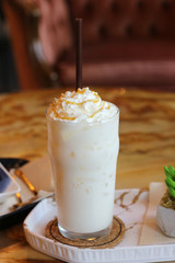 Cold milk on table at cafe.