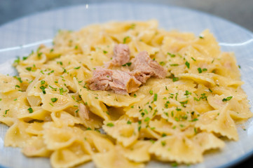 Delicious traditional Italian food. Pasta tuna, cheese and spices