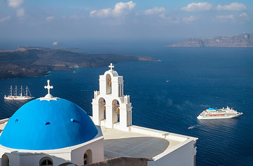 Fototapeta na wymiar Three Bells of Fira Church is famed for its three bells, blue dome, and picturesque caldera views, Santorini, Greece.