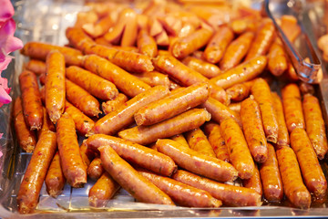 Sausages in container at market 