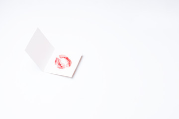 Valentine's Day shape kissing lips on holiday greeting card.Romantic love minimal concept background. Copy space, top view, flat lay. Horizontal orientation