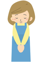 謝罪する女性店員