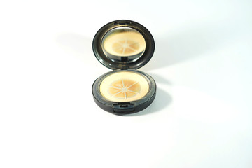 Face powders after used (Hit pan) in round shape with a mirror in front view.Face cosmetic makeup compact powder, foundation make-up.