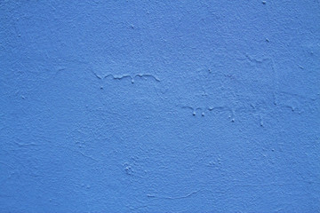 Blue abstract background..Beautiful blue textured plaster on the wall..Background from blue stucco..