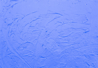 Texture of blue smeared plaster.