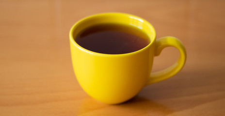 A cup of tea on the wooden table
