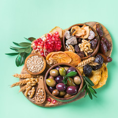 Tu Bishvat holiday symbols - dried fruits, pomegranate, barley, wheat