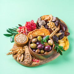 Tu Bishvat holiday symbols - dried fruits, pomegranate, barley, wheat