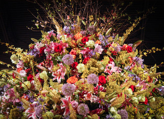 Huge and dramatic flower arrangement with dramatic black background