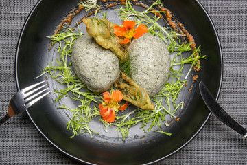 Stir fried potatoes in seaweed crust stuffed with tuna tartar. Exquisite dish. Creative restaurant meal concept.	