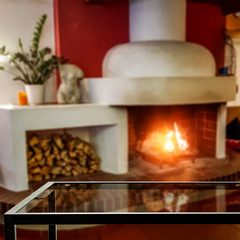 Desk of free space and home interior with fireplace 