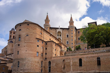 Fototapeta na wymiar The ancient walls and towers of the medieval Ducale Palace of Urbino (Marche Region, Italy).