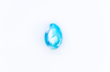 Happy Easter card. Close-up perfect painted egg in blue color isolated on white background