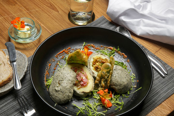 Stir fried potatoes in seaweed crust stuffed with tuna tartar. Exquisite dish. Creative restaurant meal concept.	