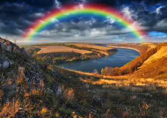 rainbow over the river. Dnister River Canyon. autumn morning